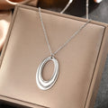 DOTIFI  Stainless Steel Delicate Hollow Arc Circle Geometric Pendant Necklace Female Fashion Minimalist Commuter Long Necklace